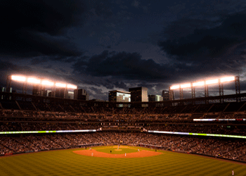 coors field during evening baseball game