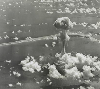Historic black and white photo of mushroom cloud during Operation Crossroads nuclear weapons test on Bikini Atoll