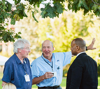 alumni enjoy refreshments and conversation on the quad during Blue & Gold weekend