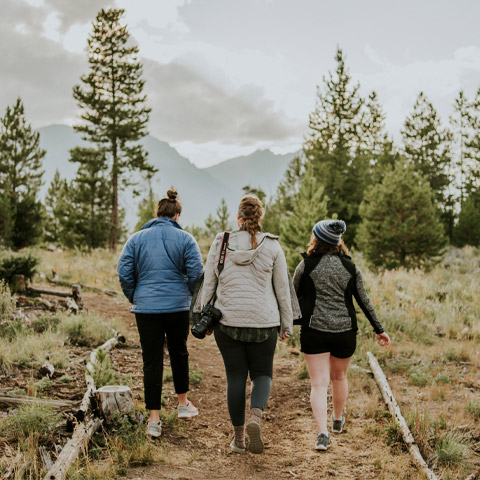 students hike on a trail during an outdoor adventure program excursion