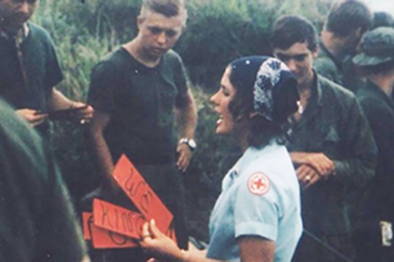 archival photo of red cross volunteer and military personnel in Vietnam during the Vietnam War