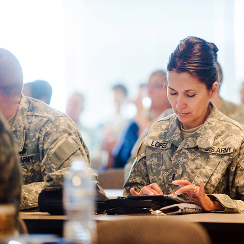 military students take notes during class