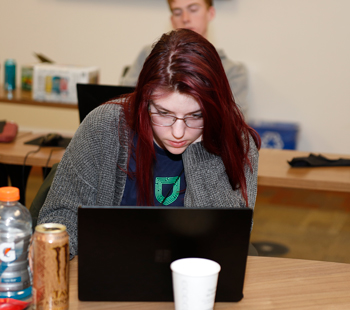 a participant working on laptop