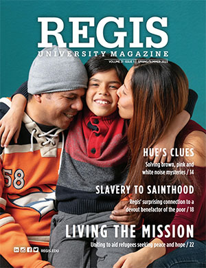 Cover of the 2023 Spring/Summer Regis Magazine featuring the cover story "Living the Mission" with two parents embracing their young child