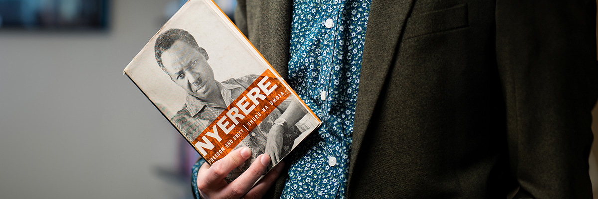 Person holding a book: Nyerere