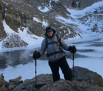 Roger Pomainville smiles for a photo at Chasm Lake (12,143’) below the East Face of Longs Peak (14,252’) on Dec. 22, 2019.