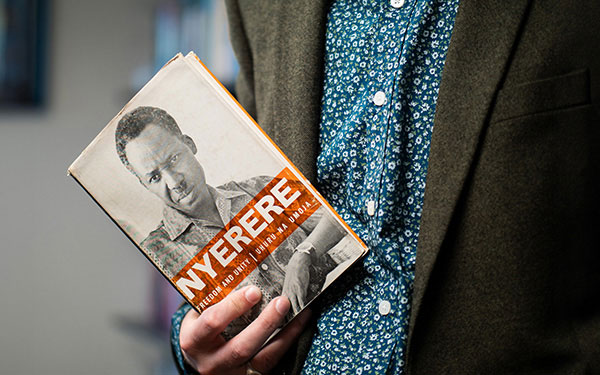 Person holding a book: Nyerere