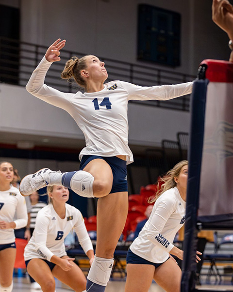 Nadine winds back to hit a volleyball