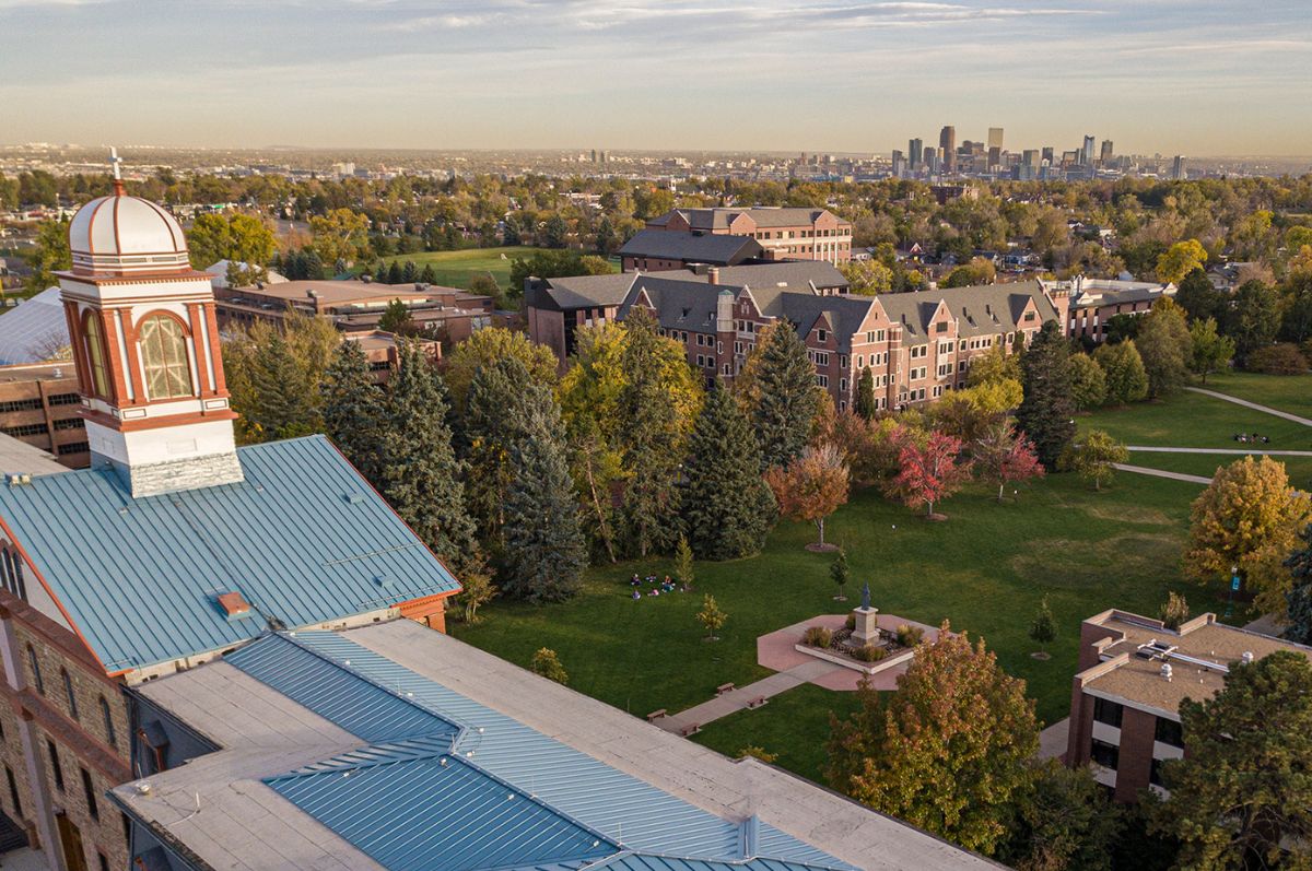 aerial photo of regis campus and Denver skyline