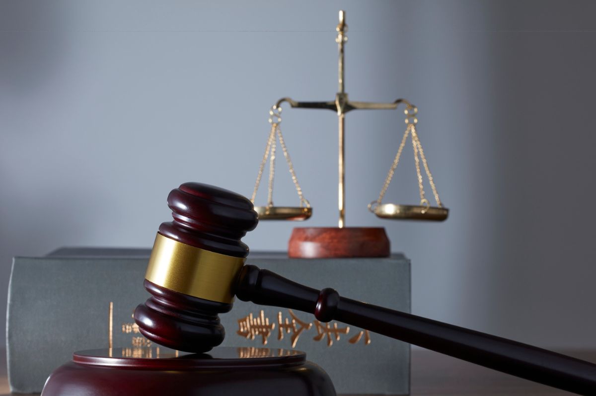 Stock photo of a hammer, gavel and Libra scales.