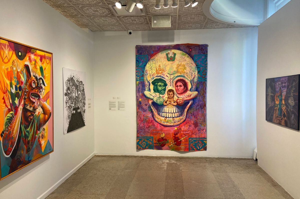 Inside of La Nepantla art exhibition showing four different art pieces.