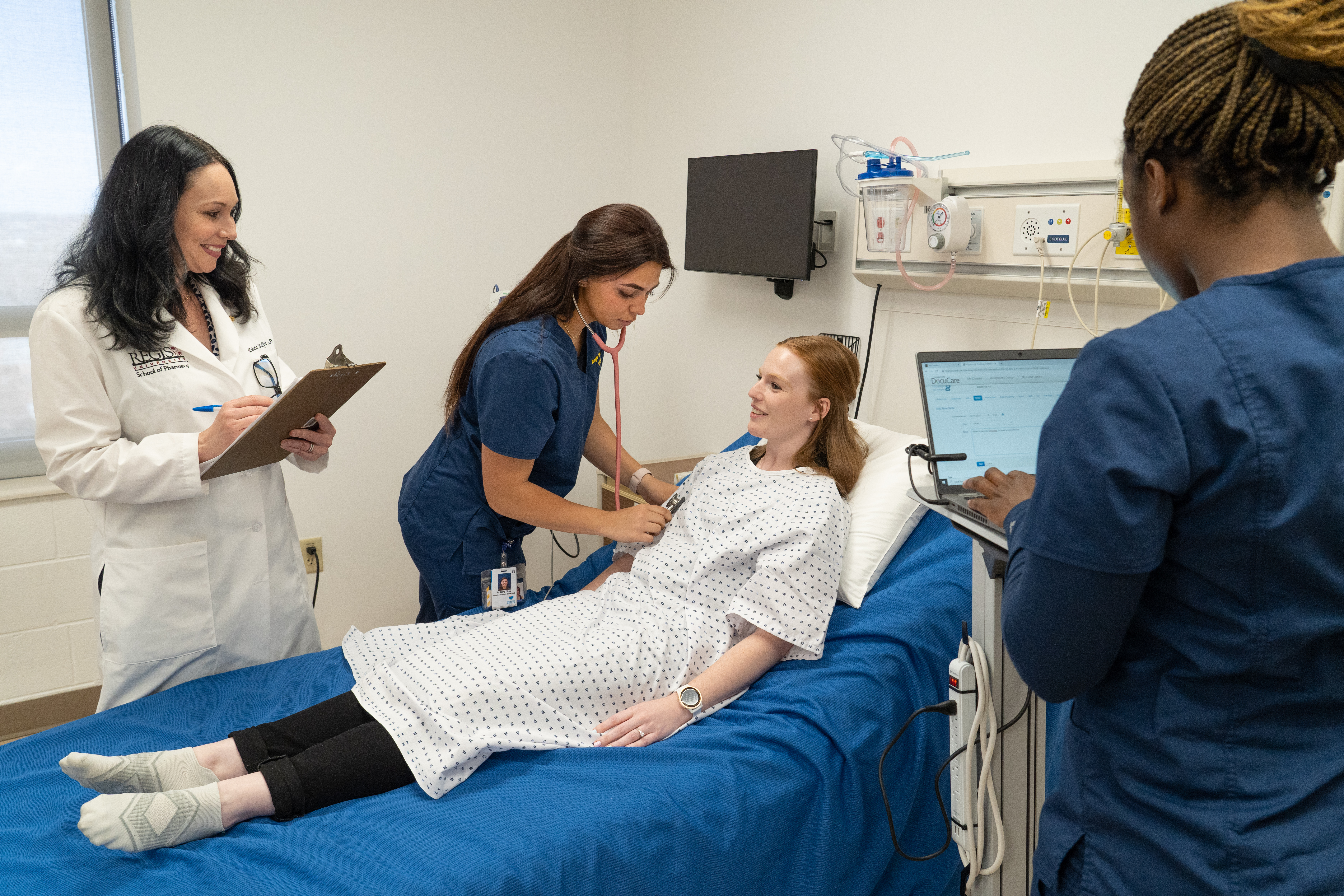 nursing students and faculty in simulation lab