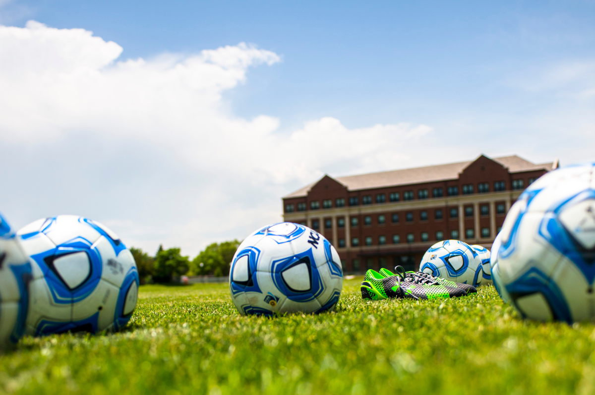 soccer balls on Regis soccer field